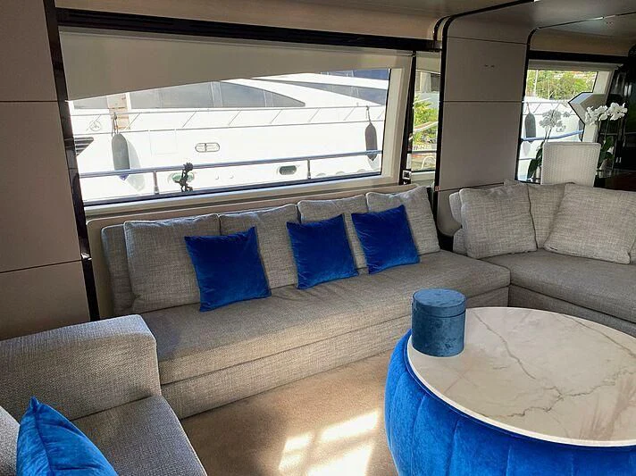 a couch with pillows and a table aboard SOLSTICE Yacht for Sale