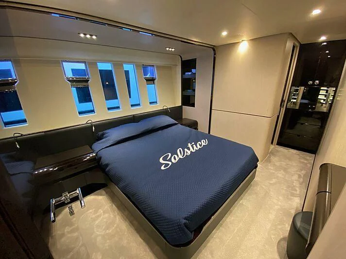 a room with a bed and a tv aboard SOLSTICE Yacht for Sale