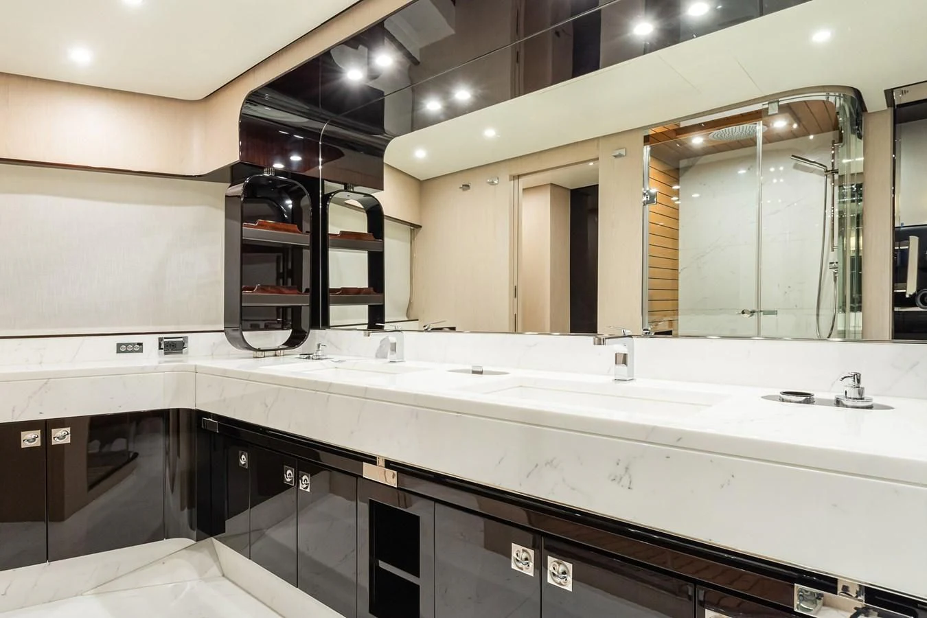 a large bathroom with a large mirror aboard SOLSTICE Yacht for Sale