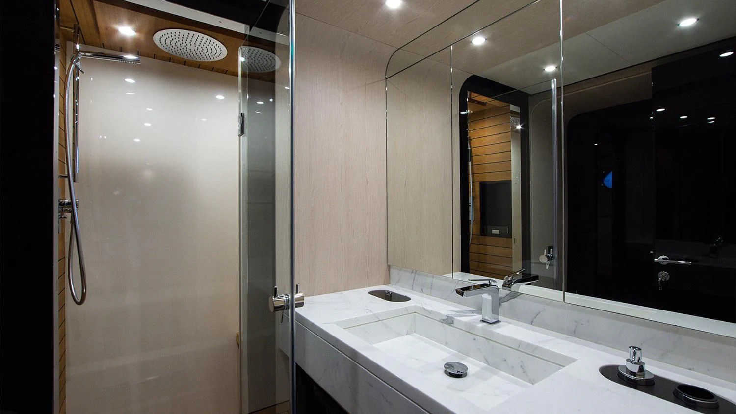 a bathroom with a large mirror aboard SOLSTICE Yacht for Sale