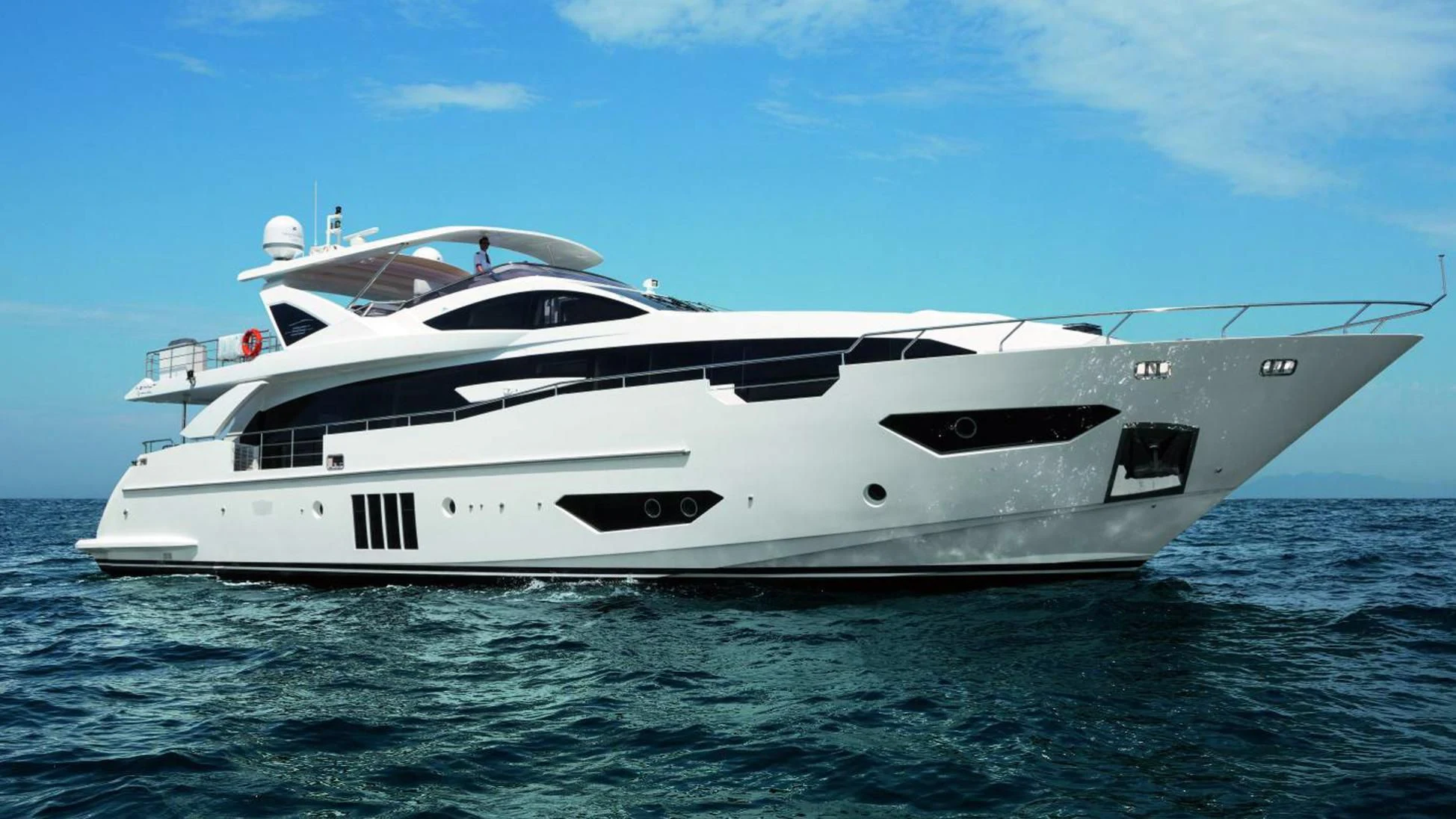 a white yacht in the water aboard SOLSTICE Yacht for Sale