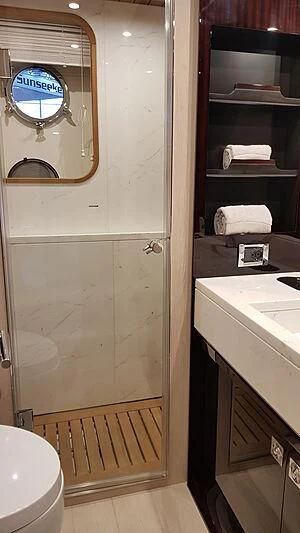 a bathroom with a glass door aboard SOLSTICE Yacht for Sale
