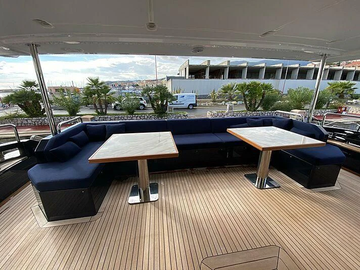 a room with a pool table and chairs aboard SOLSTICE Yacht for Sale