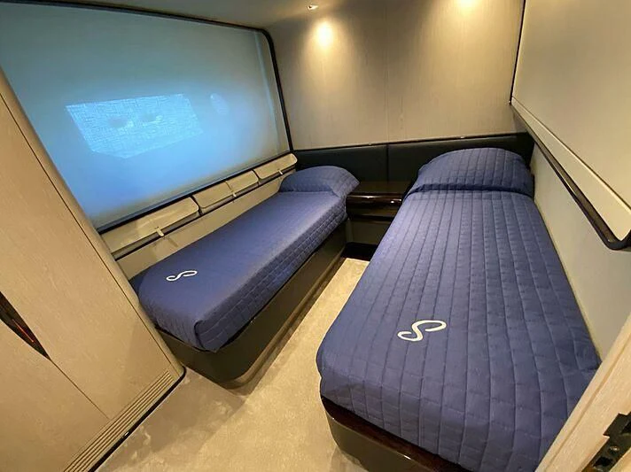 a room with a bed and a tv aboard SOLSTICE Yacht for Sale