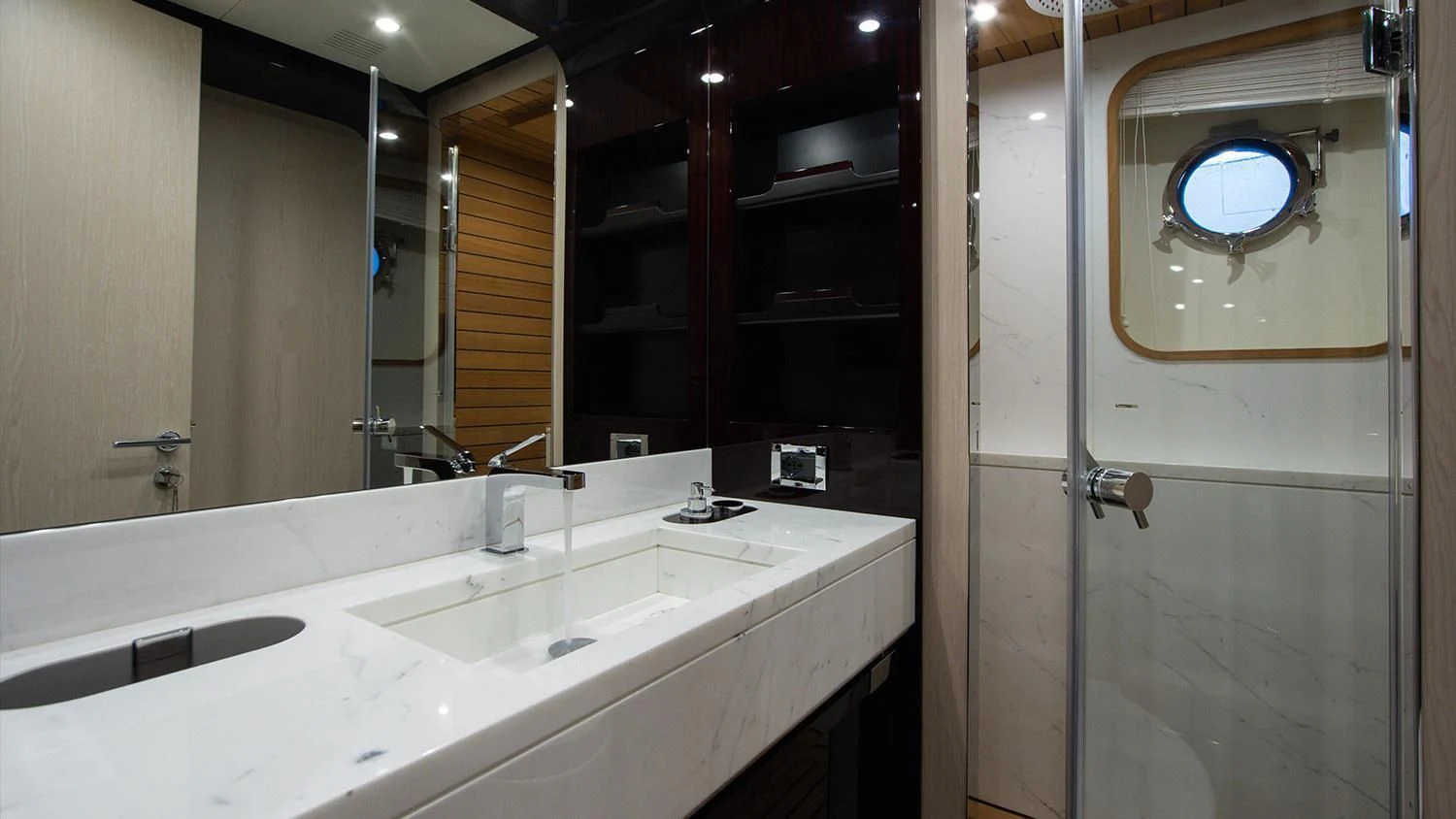 a bathroom with a large mirror aboard SOLSTICE Yacht for Sale