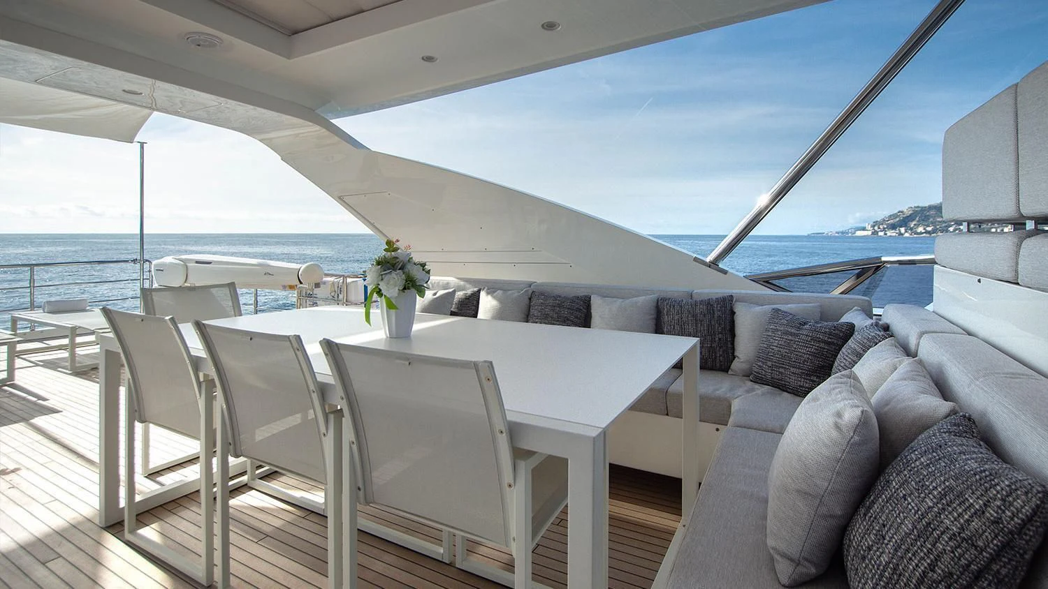 a room with a table and chairs aboard SOLSTICE Yacht for Sale