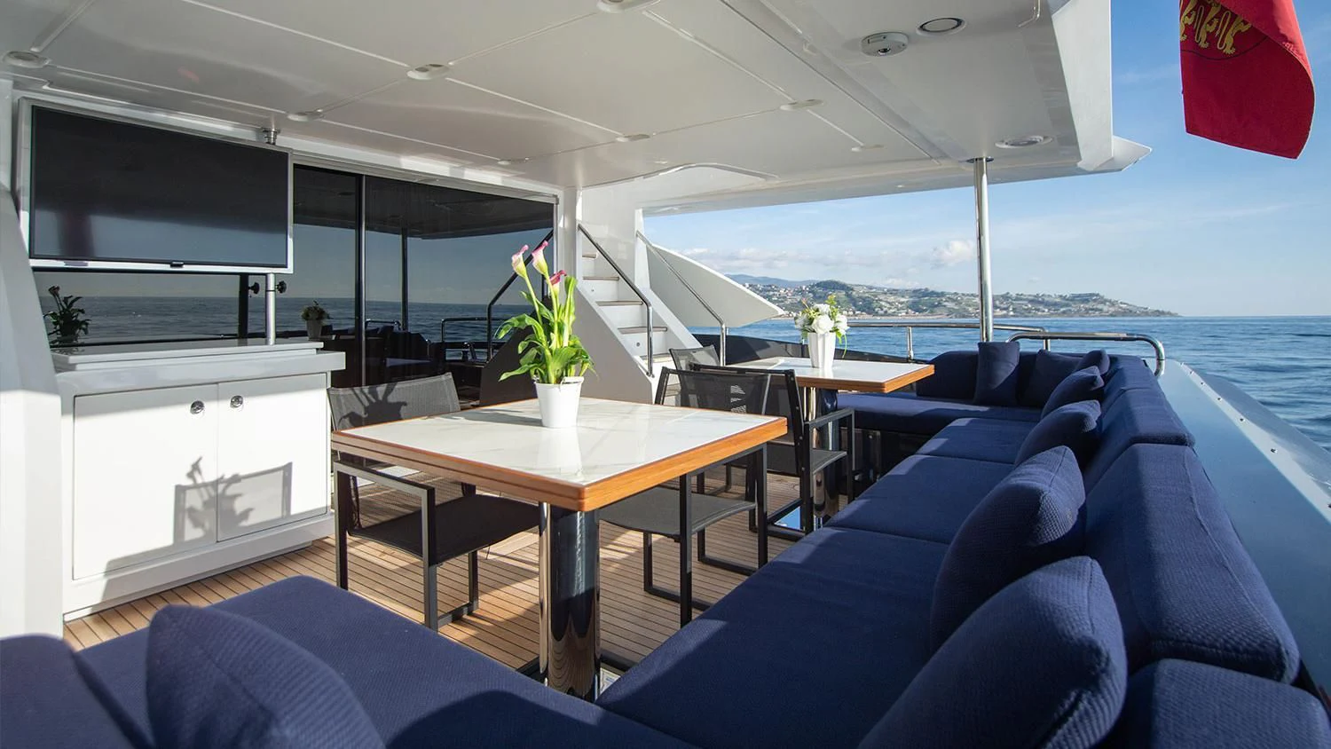 a room with a table and chairs aboard SOLSTICE Yacht for Sale