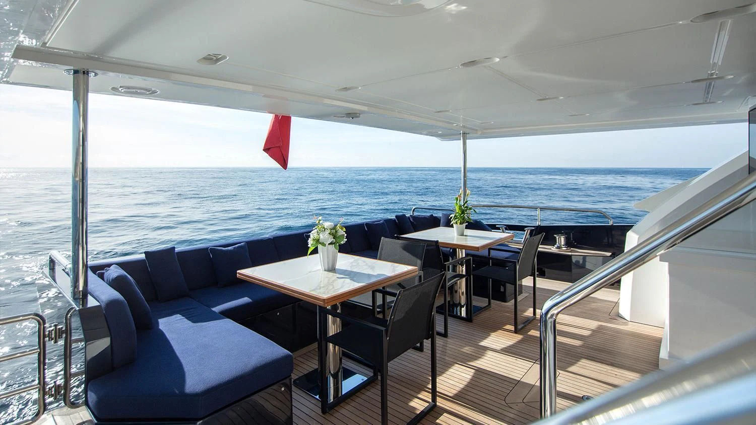 a room with a table and chairs aboard SOLSTICE Yacht for Sale