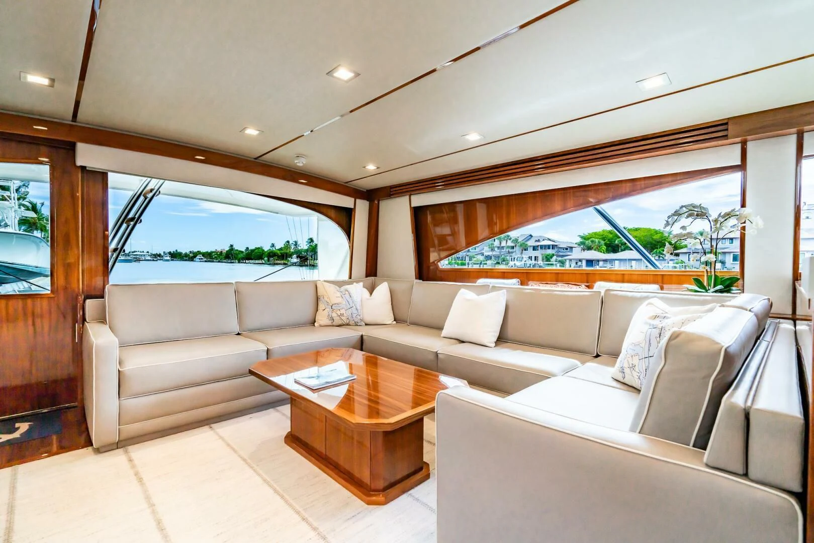 a living room with a couch and a table aboard FRIGATE Yacht for Sale