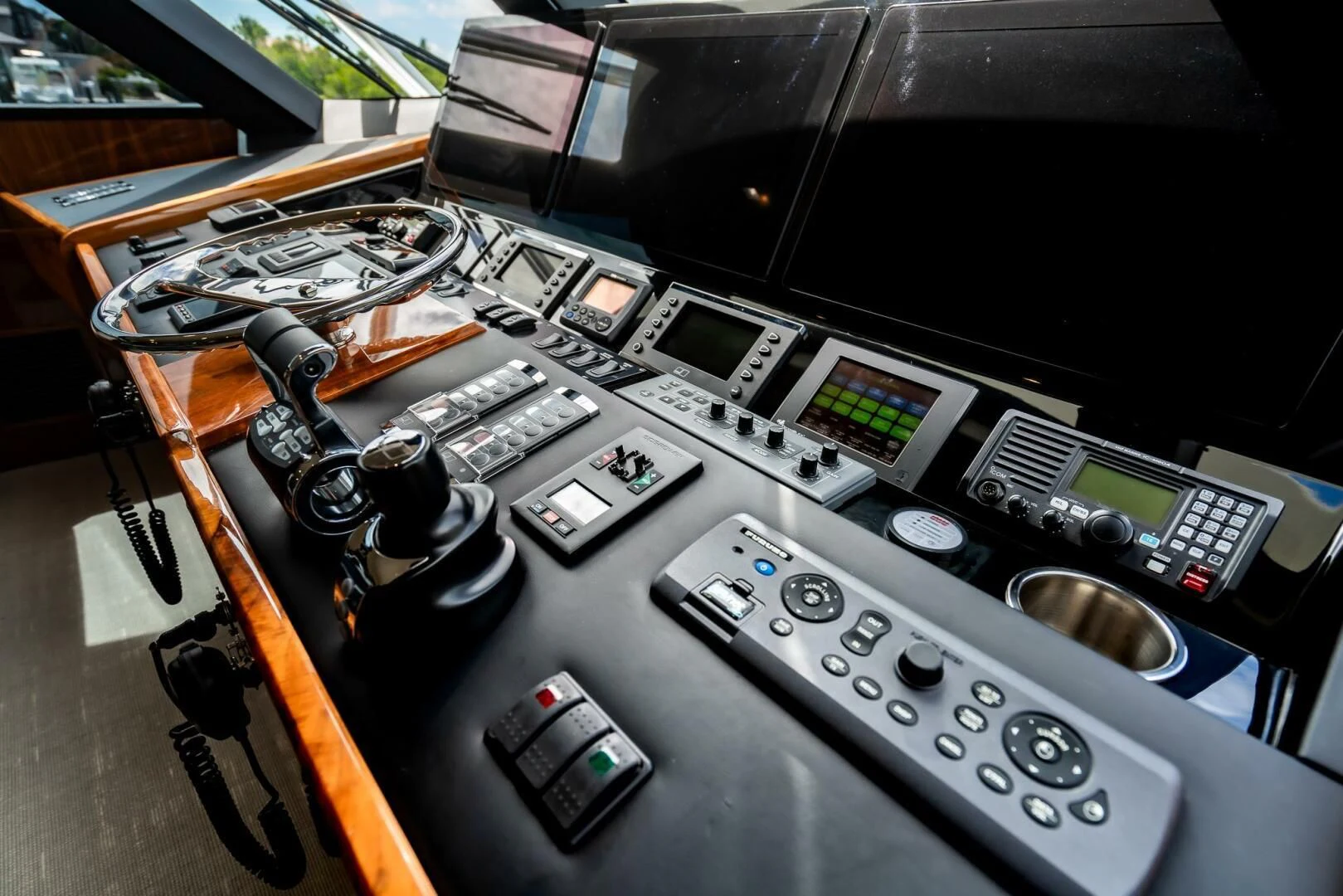 a machine with buttons and a remote control aboard FRIGATE Yacht for Sale
