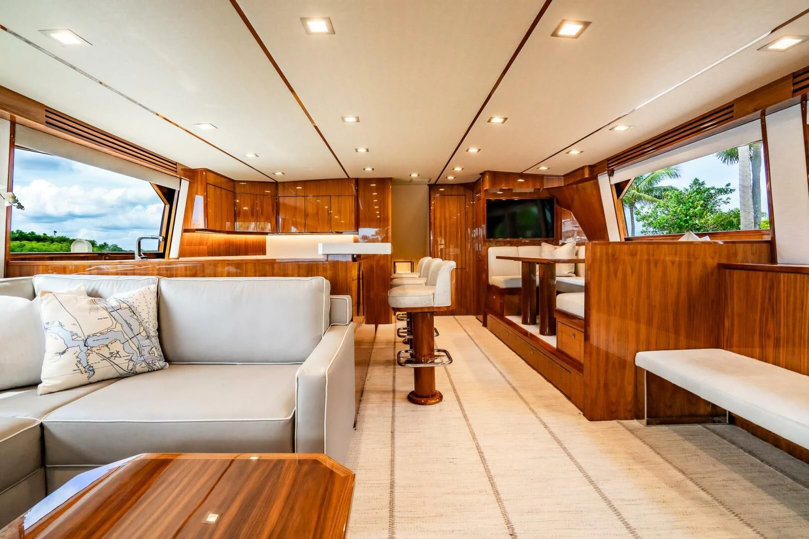 a room with a couch and a table aboard FRIGATE Yacht for Sale