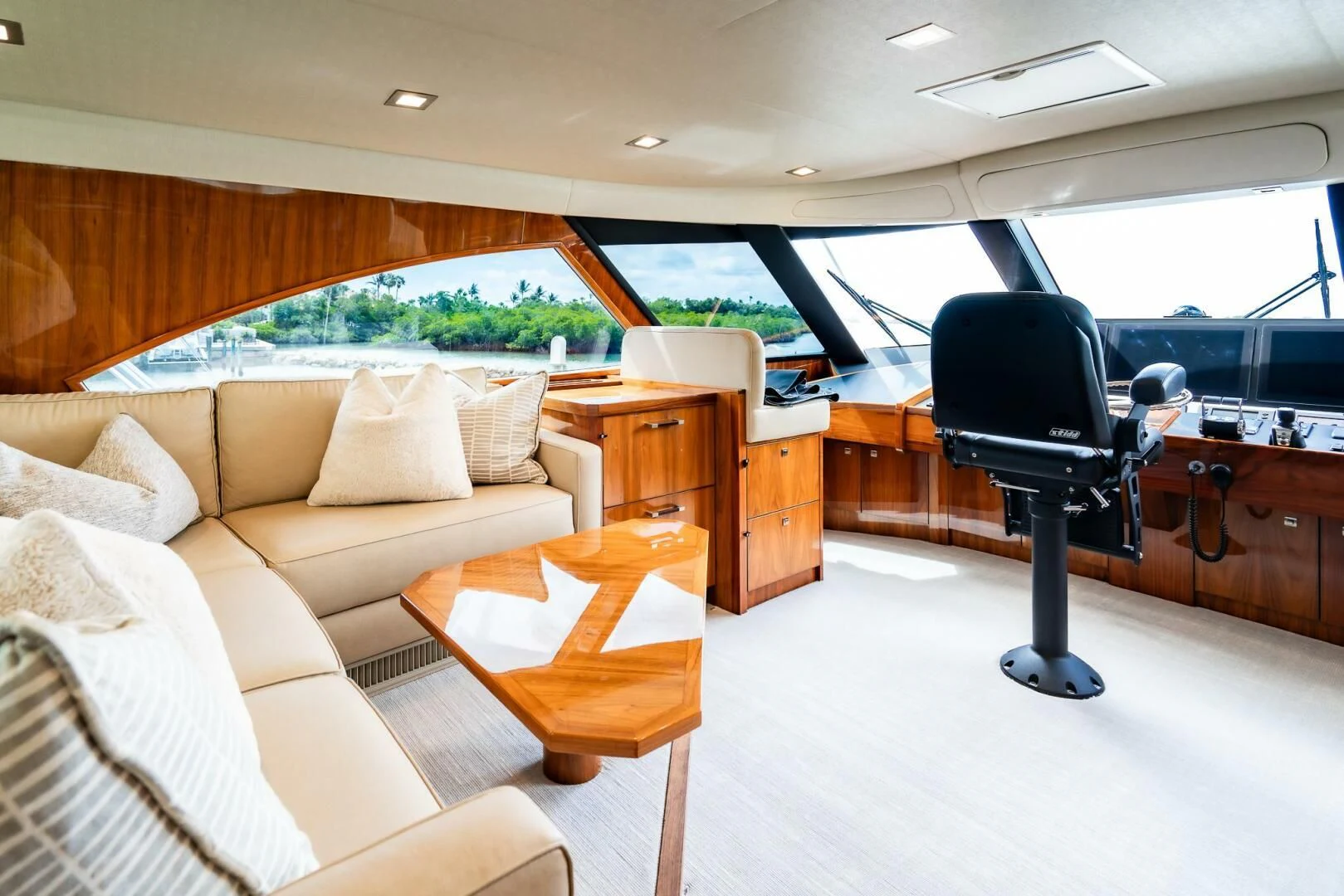 a living room with a couch and a coffee table aboard FRIGATE Yacht for Sale