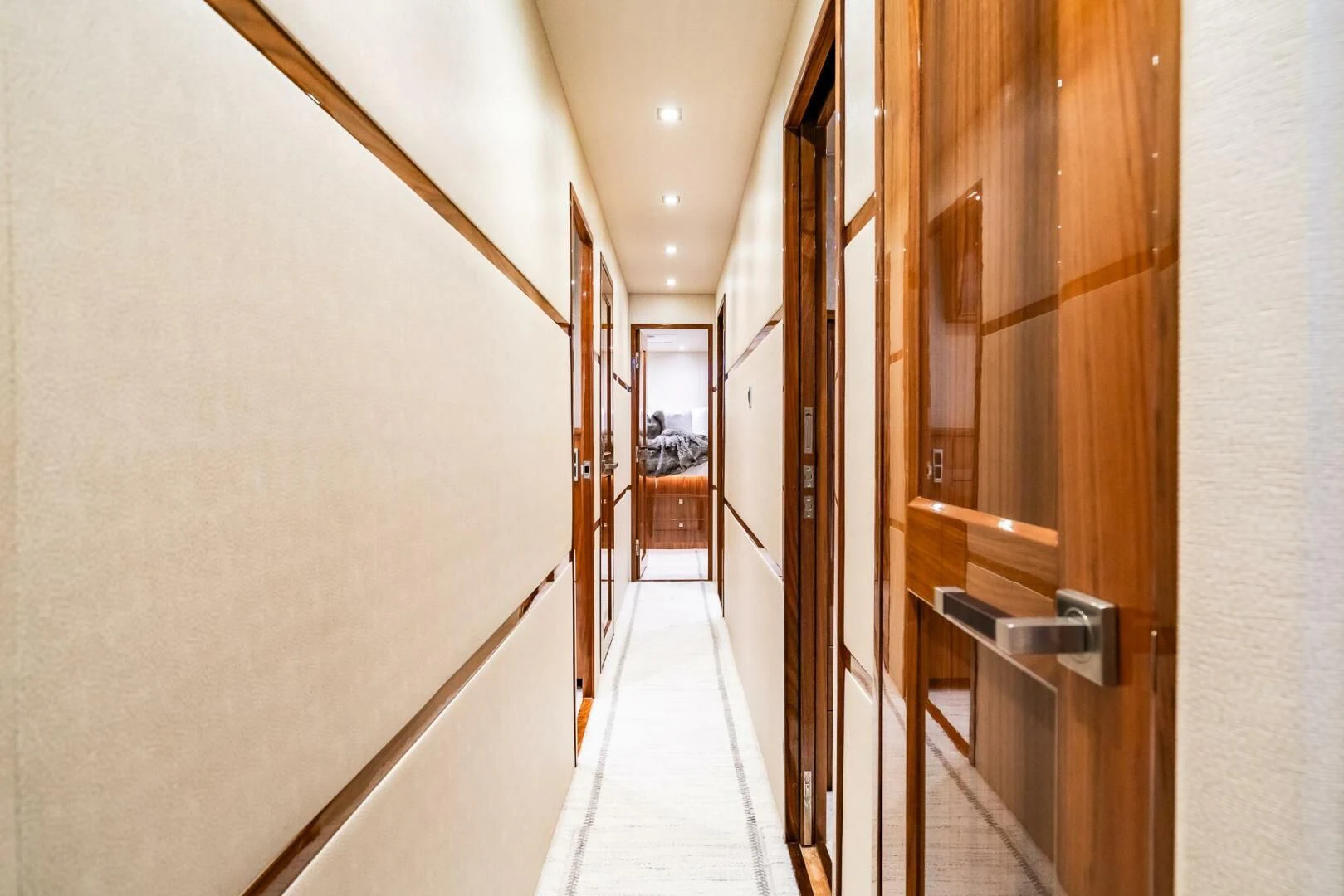 a hallway with doors aboard FRIGATE Yacht for Sale