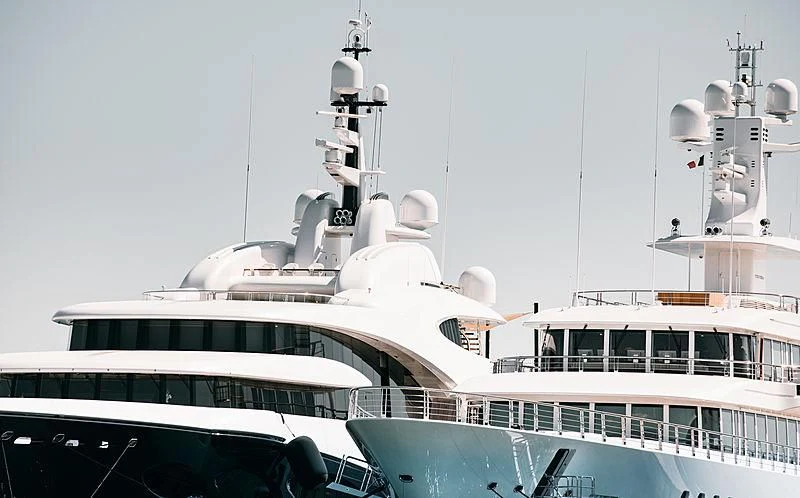 a large white boat with a large white boat on it aboard MUSASHI Yacht for Sale