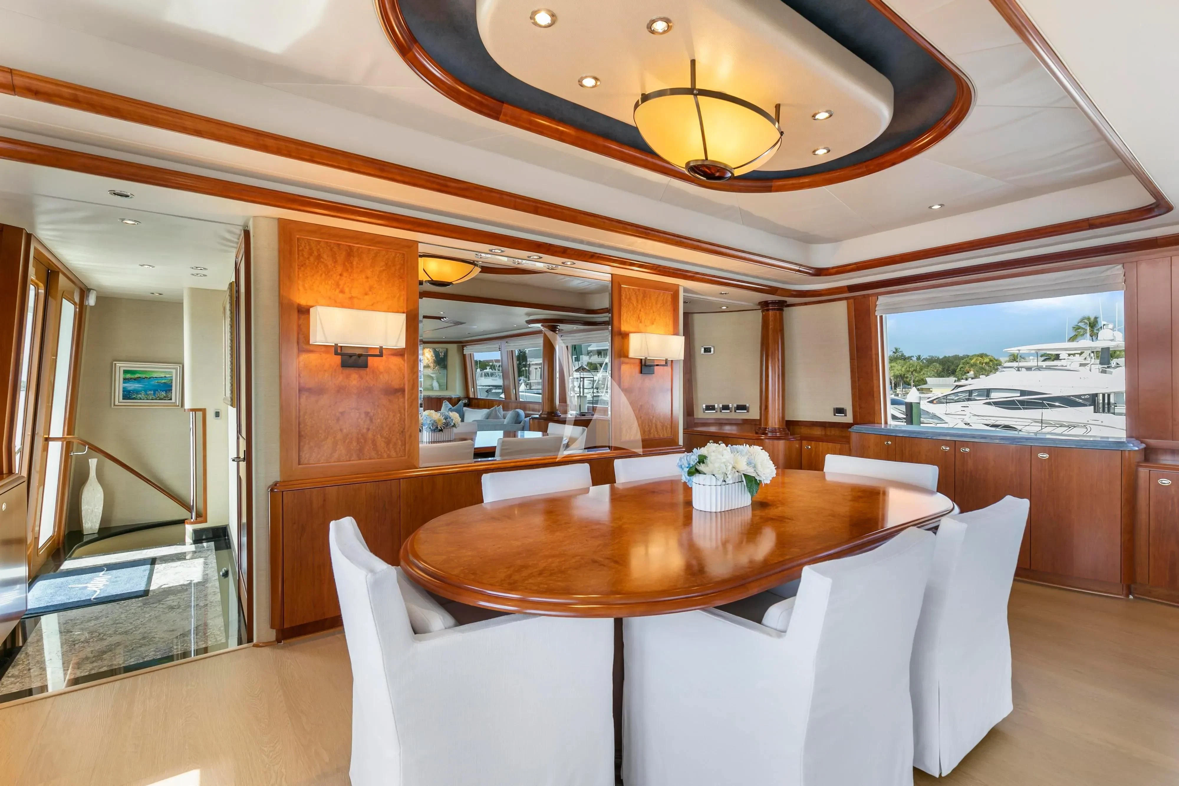 a dining table in a room aboard EDEN Yacht for Sale