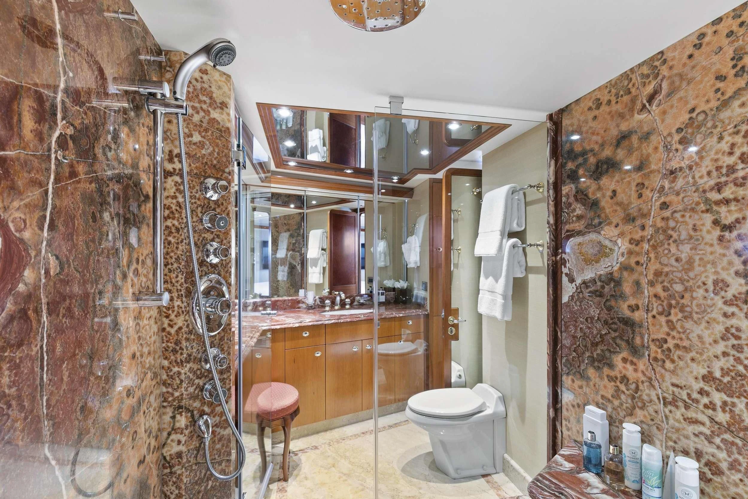 a bathroom with a shower and toilet aboard EDEN Yacht for Sale