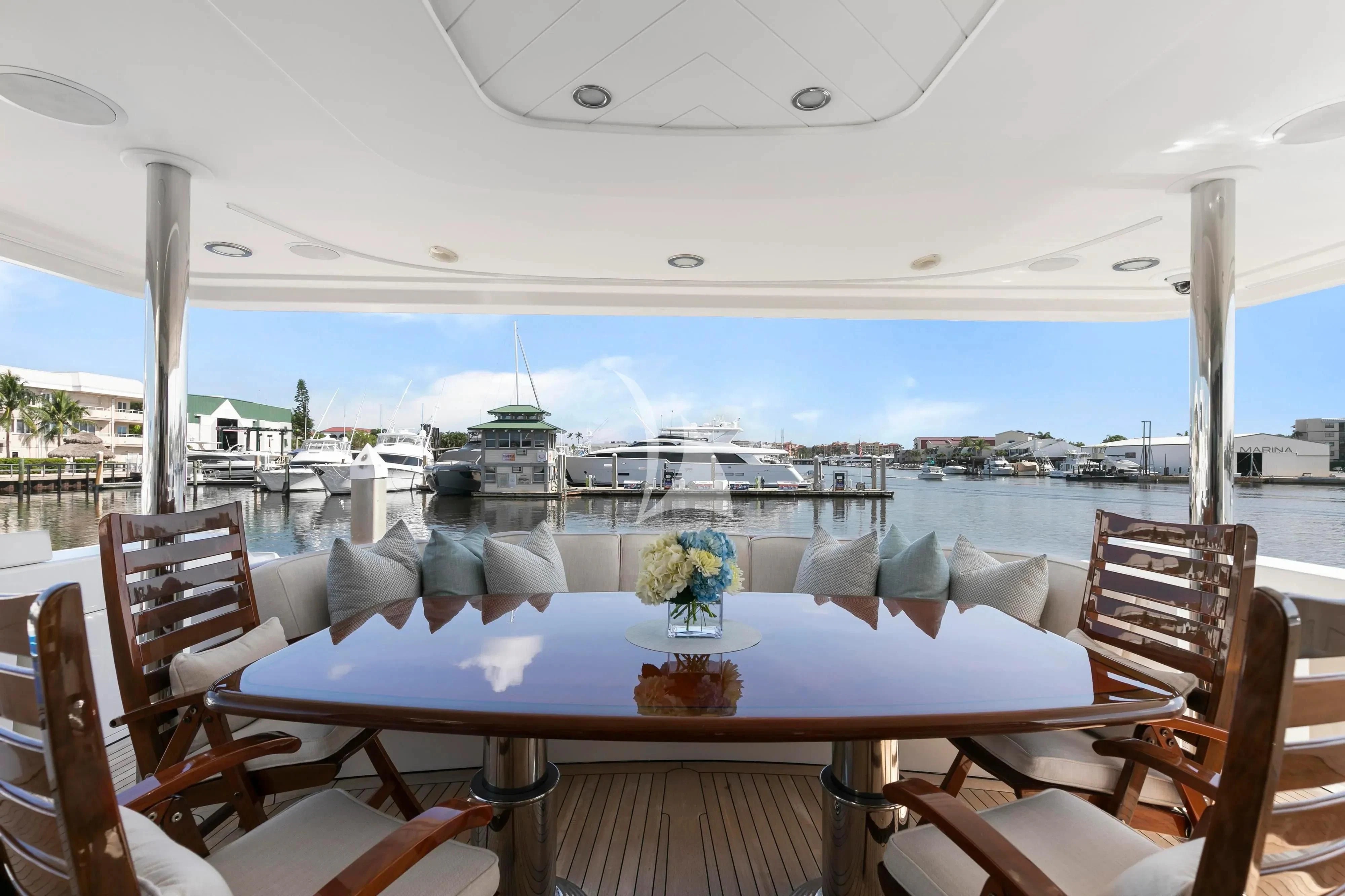 a table with chairs on it aboard EDEN Yacht for Sale