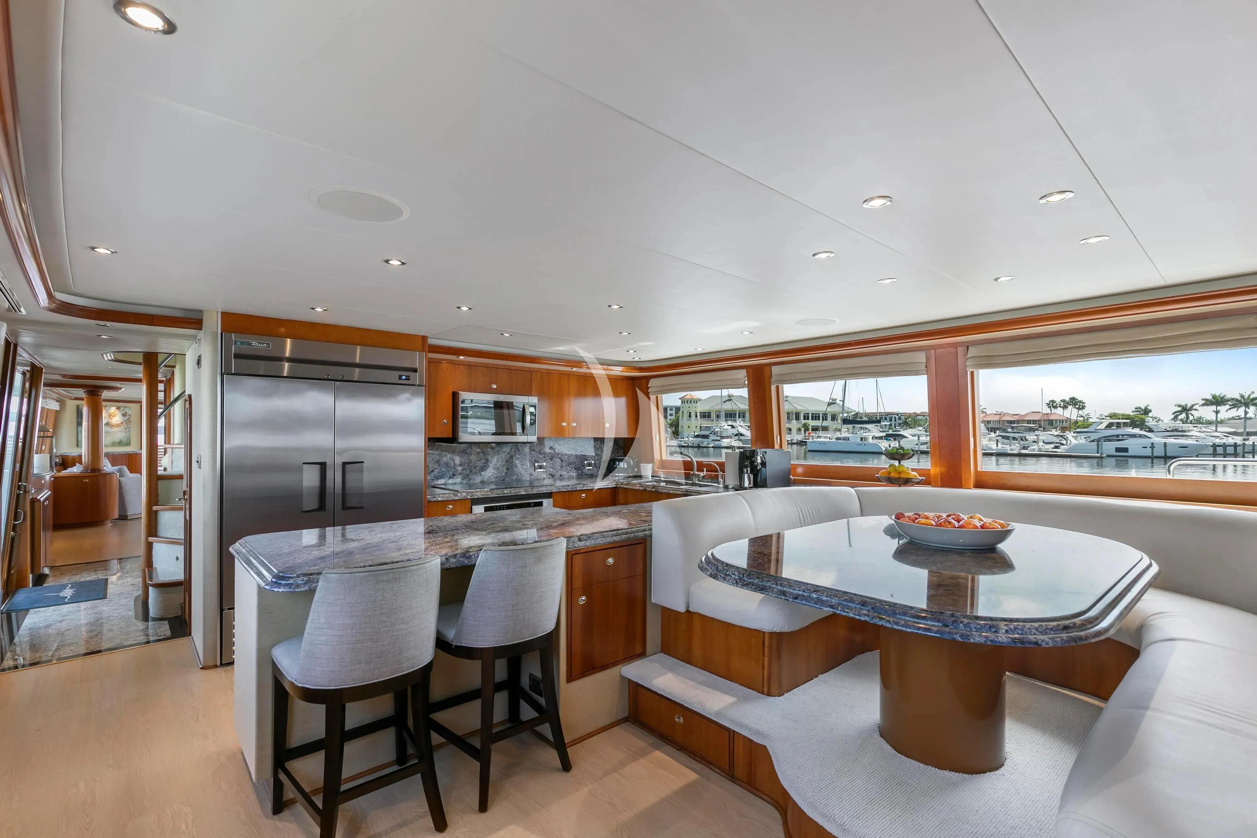 a kitchen and dining area aboard EDEN Yacht for Sale