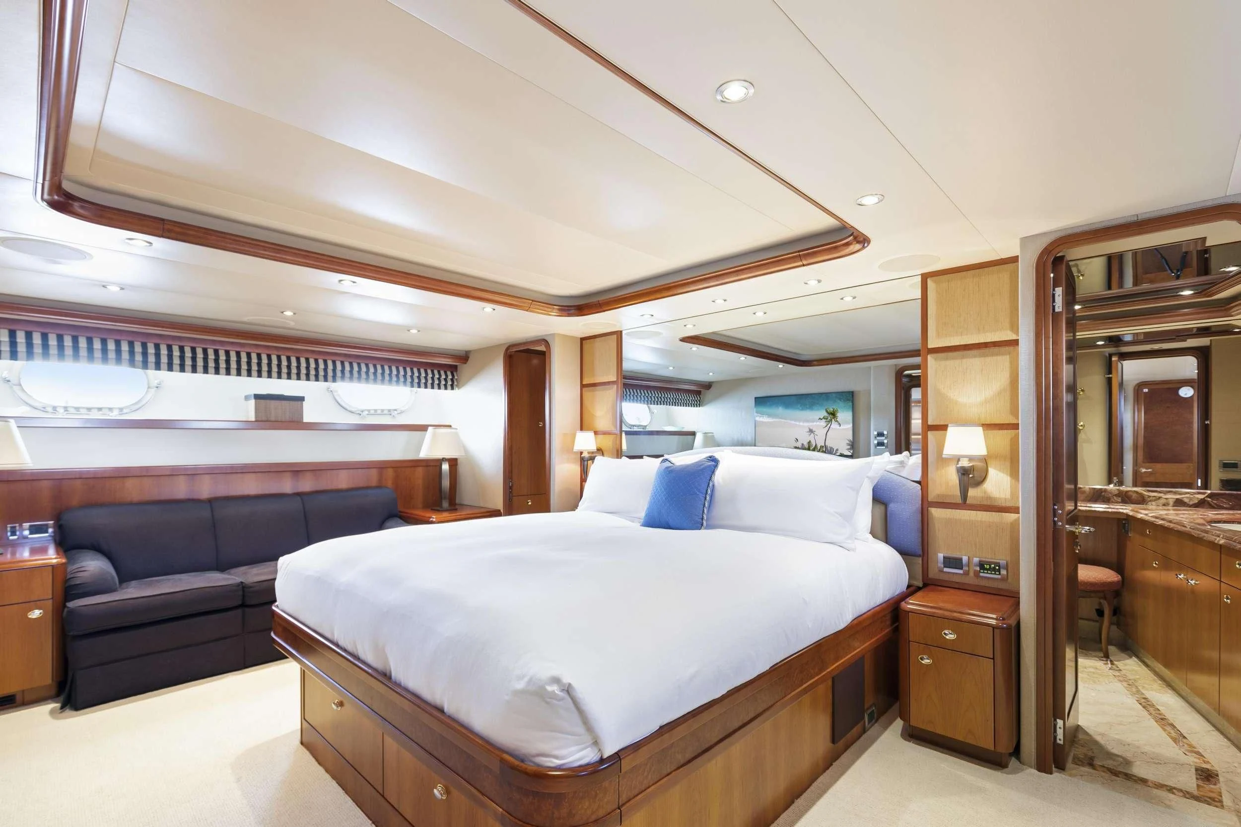 a bedroom with a bed and a couch aboard EDEN Yacht for Sale