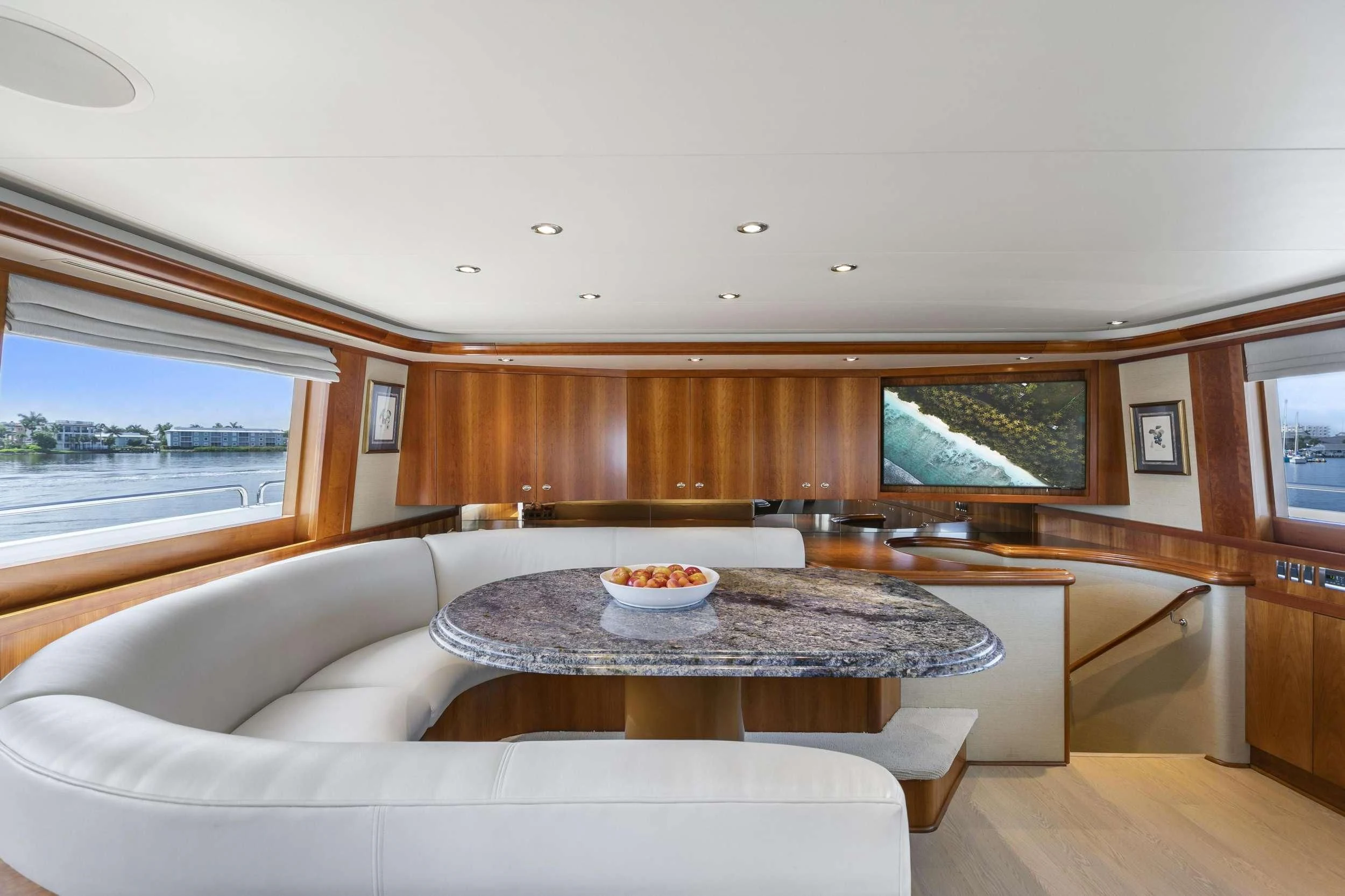 a living room with a couch and a table aboard EDEN Yacht for Sale