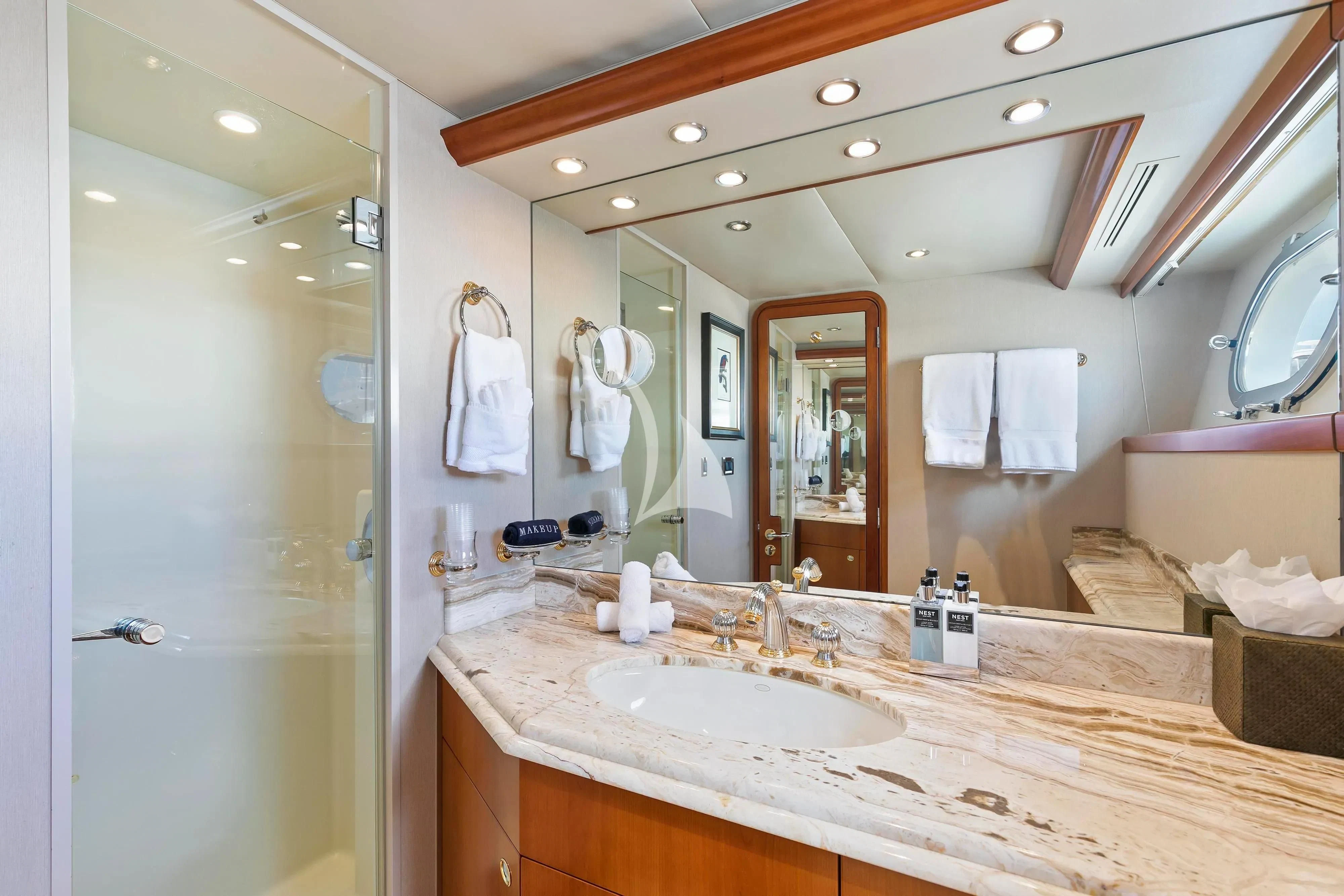 a bathroom with a large mirror aboard EDEN Yacht for Sale