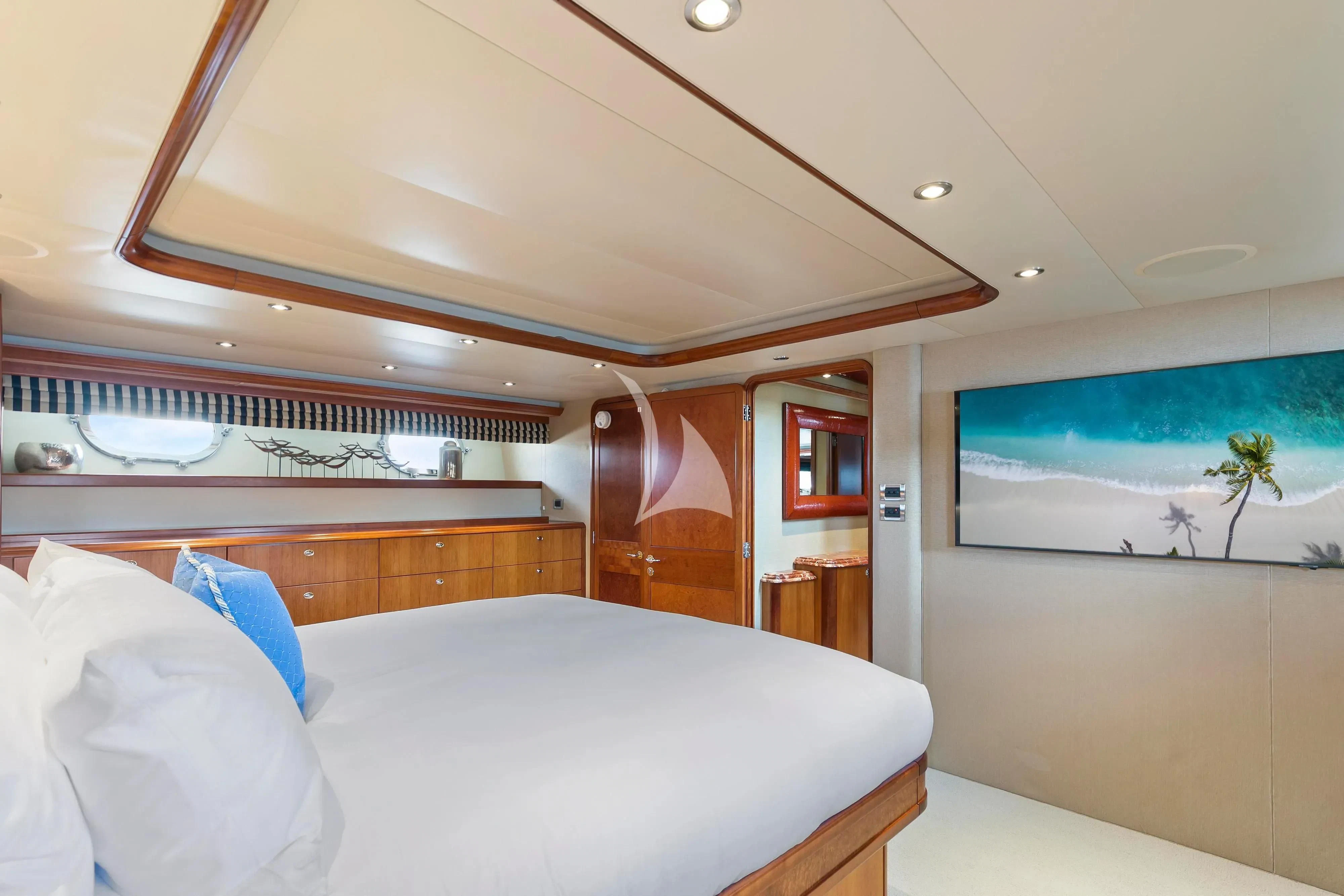 a room with a bed and a television aboard EDEN Yacht for Sale