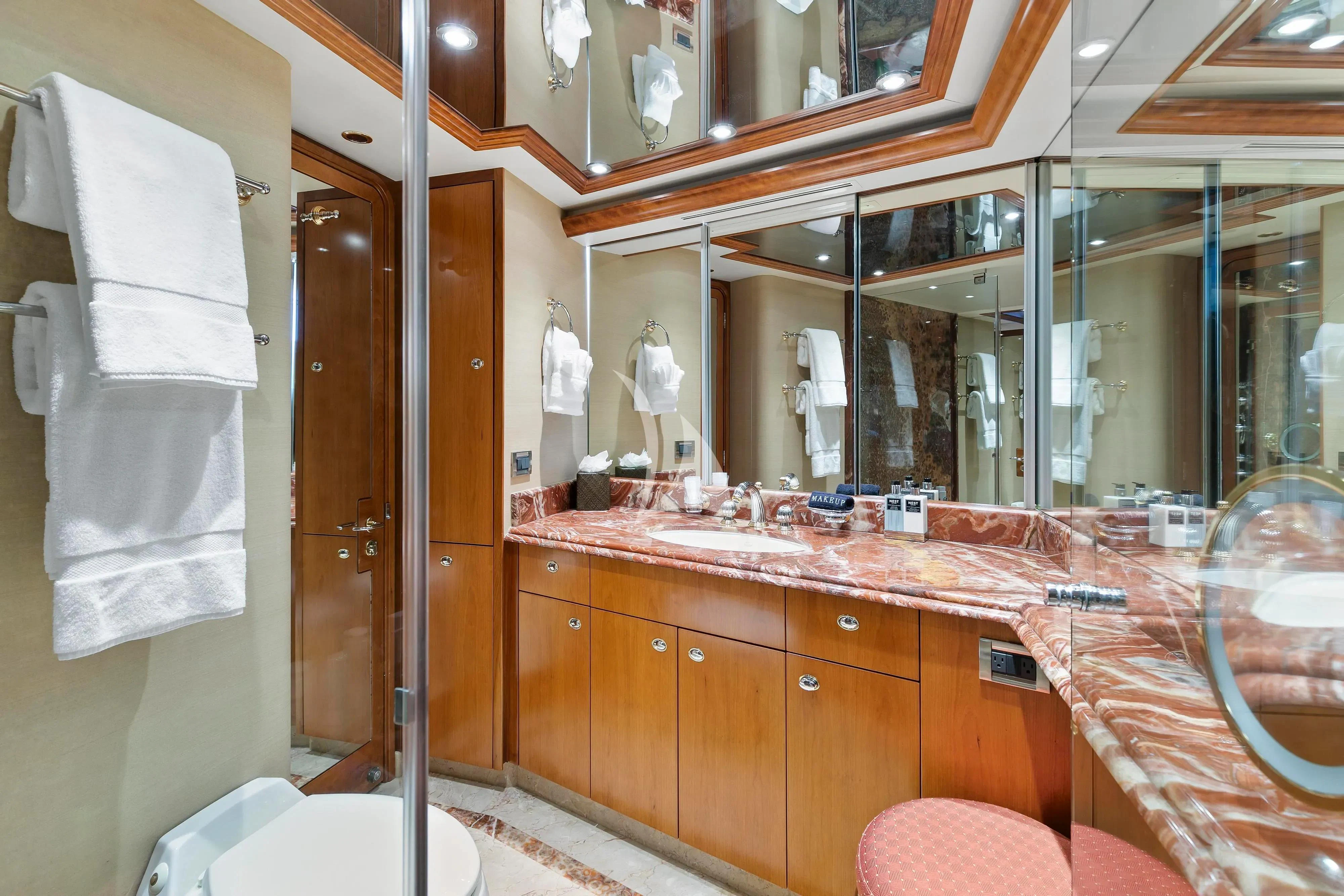 a bathroom with a large mirror aboard EDEN Yacht for Sale