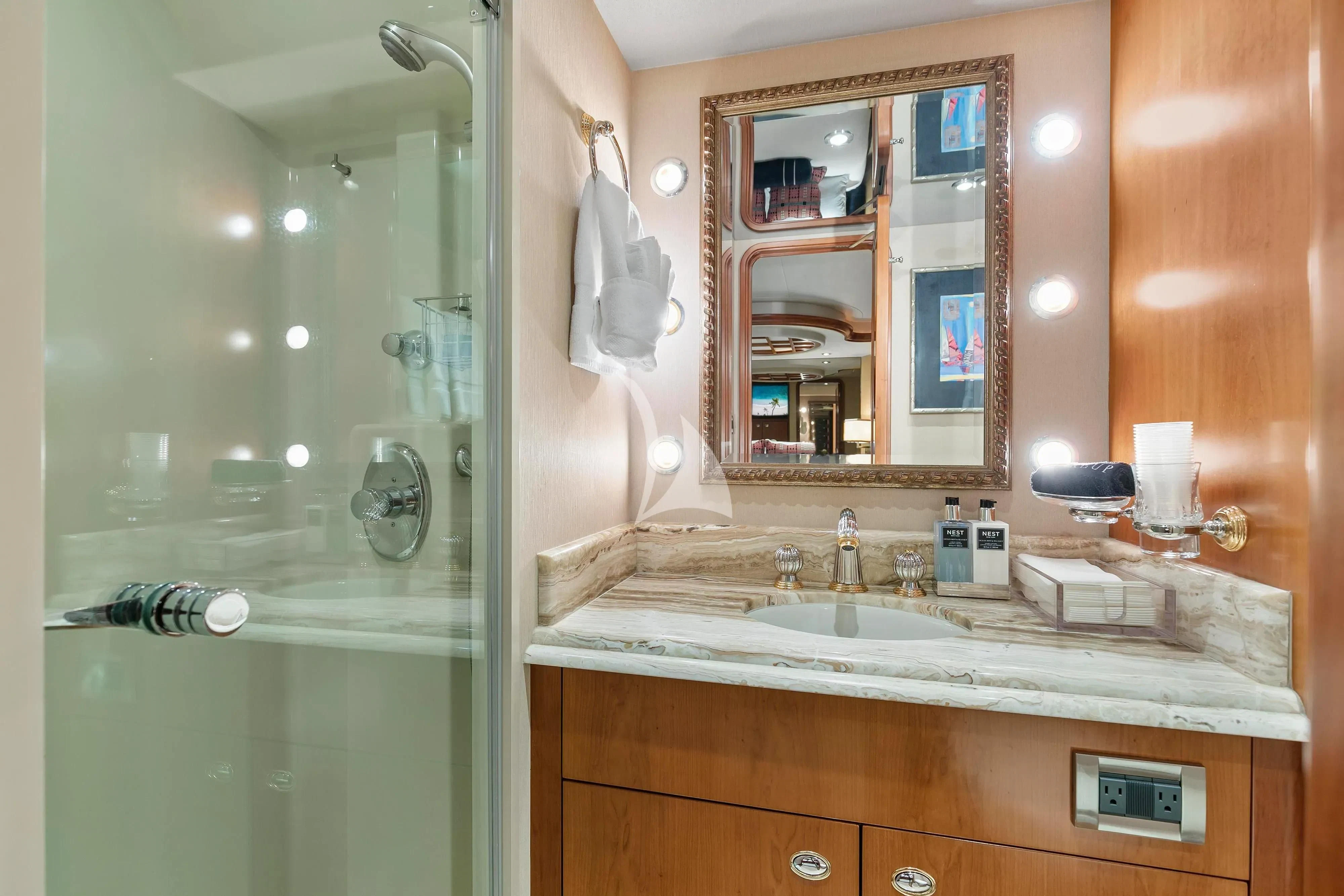 a bathroom with a large mirror aboard EDEN Yacht for Sale
