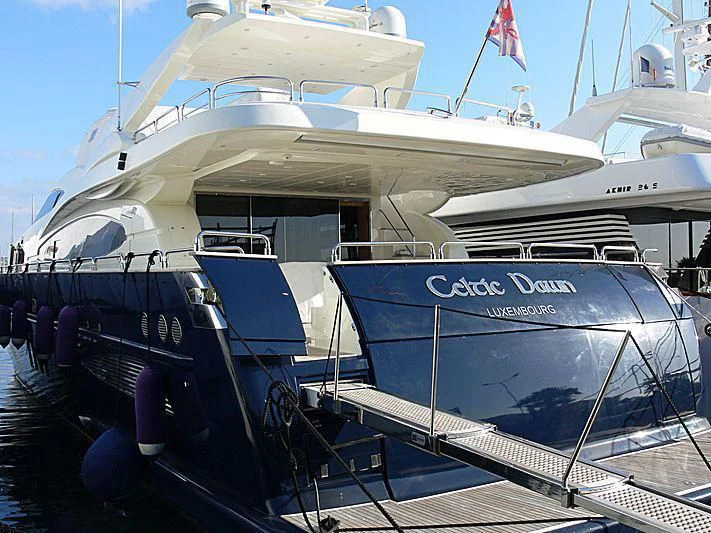 a boat docked at a pier aboard LULU Yacht for Sale