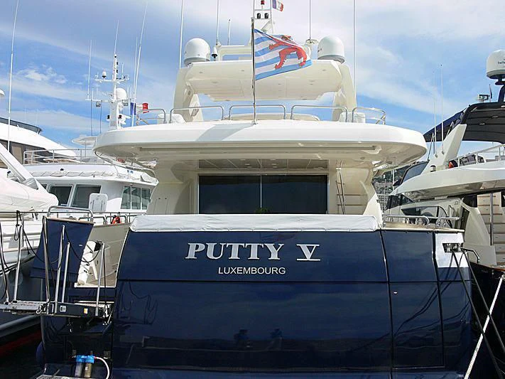 a boat parked in a harbor aboard LULU Yacht for Sale