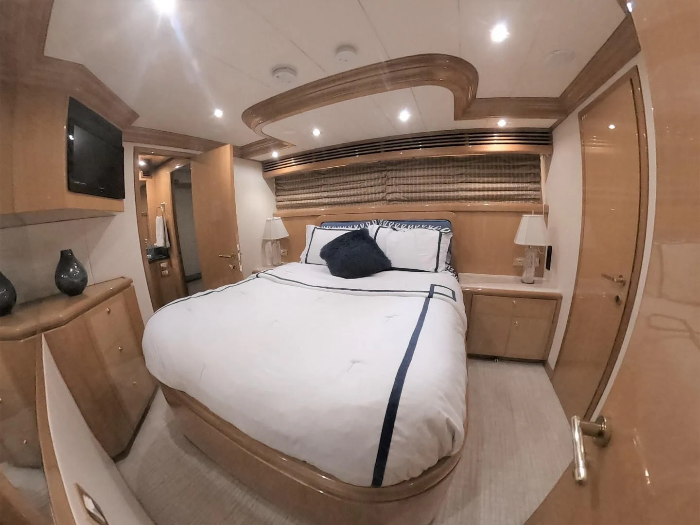 a bedroom with a bed and a sink aboard SEAS THE DAY Yacht for Sale