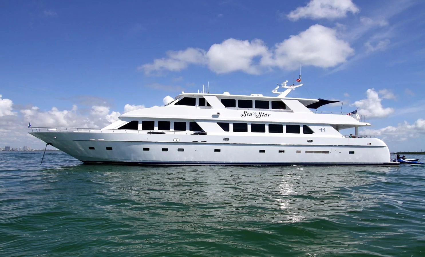 a white yacht in the water aboard SEAS THE DAY Yacht for Sale