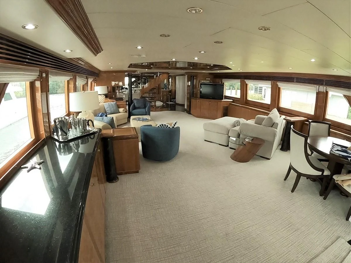 a living room with a large window aboard SEAS THE DAY Yacht for Sale