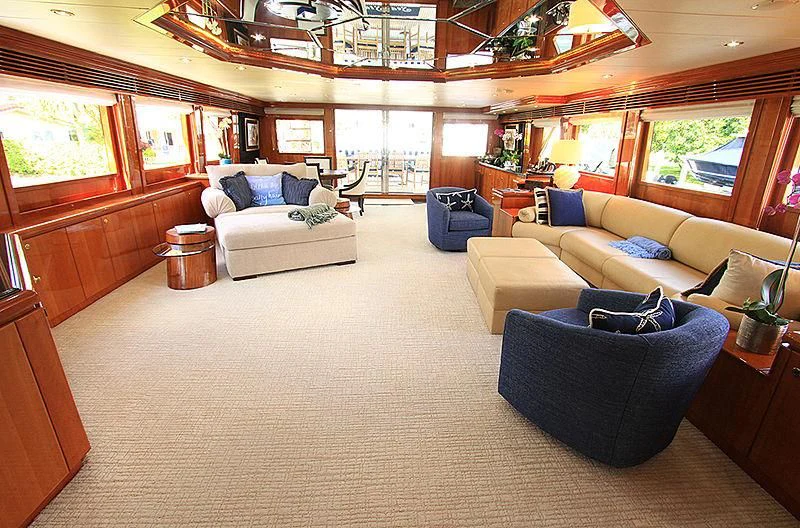 a living room with a couch and a table aboard SEAS THE DAY Yacht for Sale