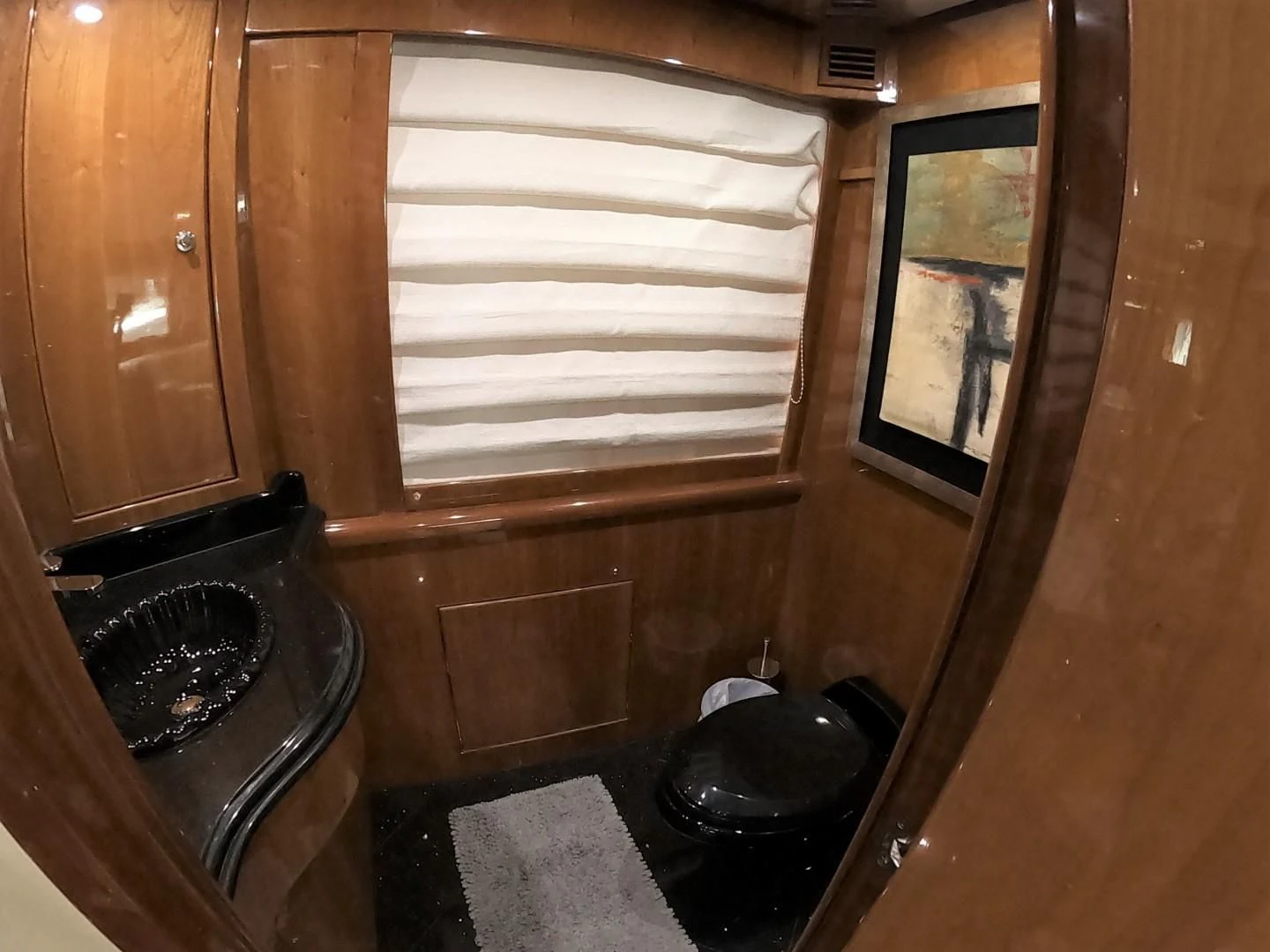 a bathroom with a black tub aboard SEAS THE DAY Yacht for Sale