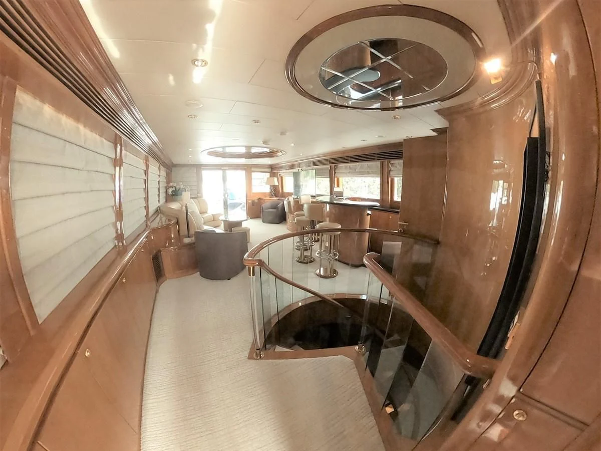 a room with a table and chairs aboard SEAS THE DAY Yacht for Sale