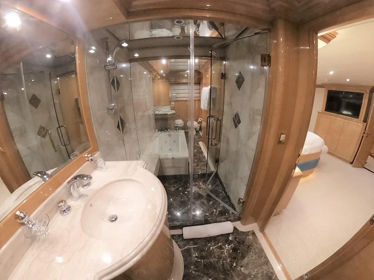 a bathroom with a large shower aboard SEAS THE DAY Yacht for Sale
