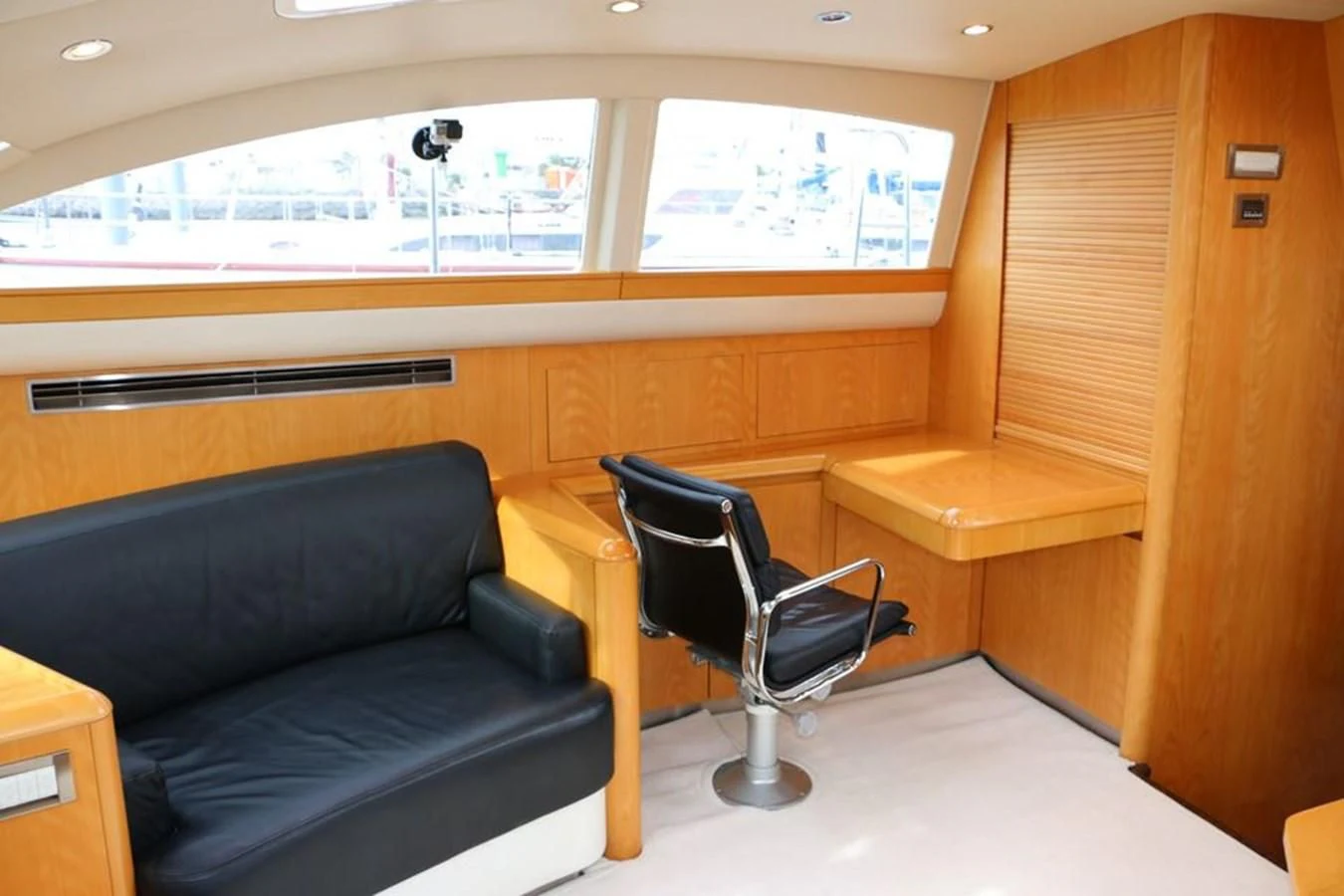 a room with a couch and a chair aboard LA LUNA Yacht for Sale