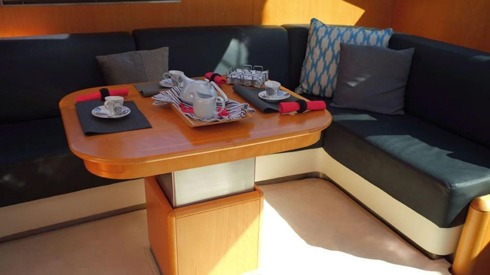 a coffee table with a couch aboard LA LUNA Yacht for Sale