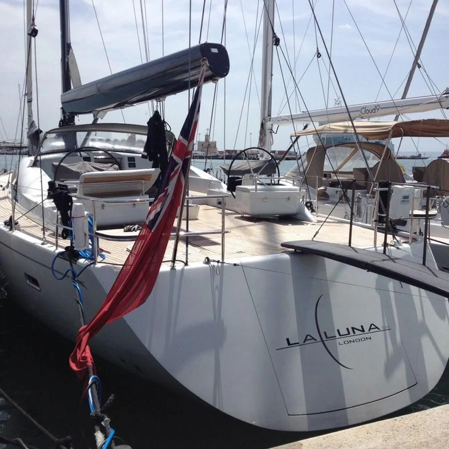 a boat with a red ribbon aboard LA LUNA Yacht for Sale
