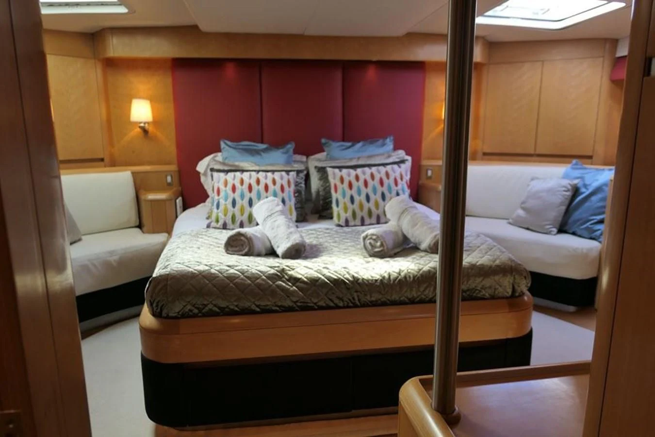 a bed with pillows on it aboard LA LUNA Yacht for Sale