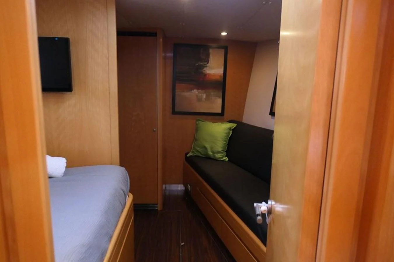 a bed and a television in a room aboard LA LUNA Yacht for Sale