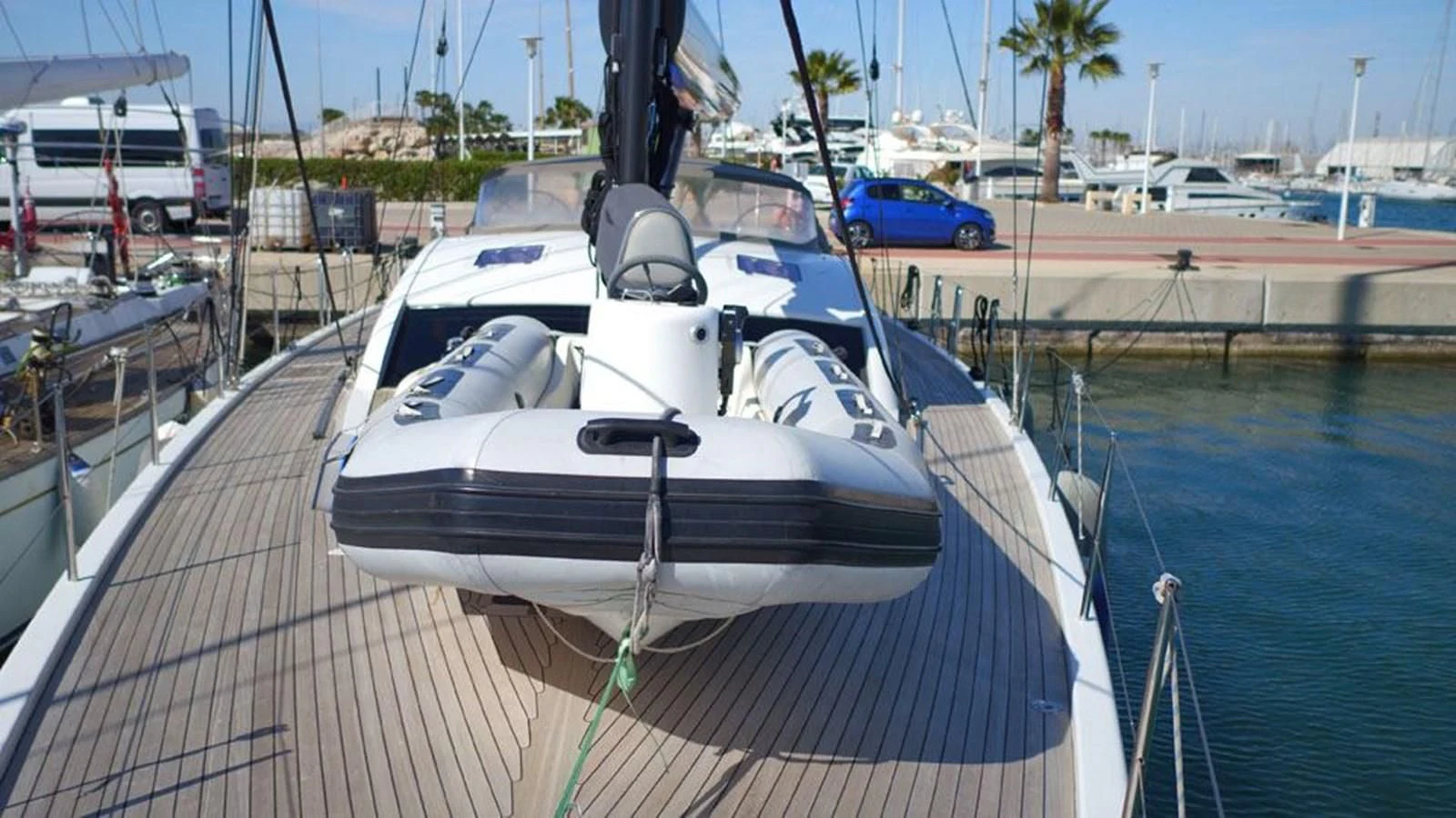 a white boat docked at a pier aboard LA LUNA Yacht for Sale