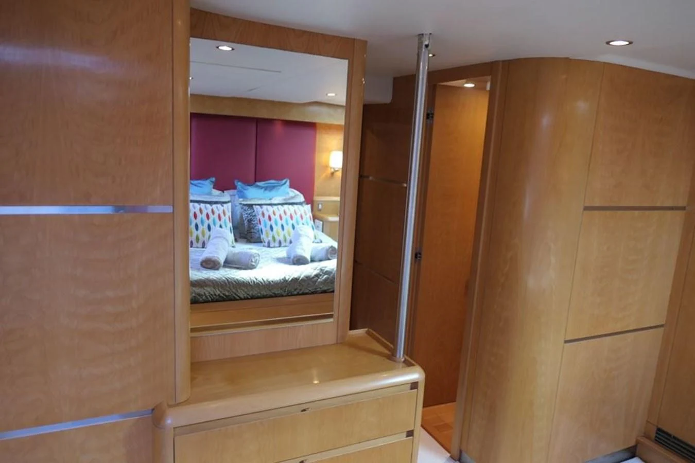 a closet with a bed and a mirror aboard LA LUNA Yacht for Sale