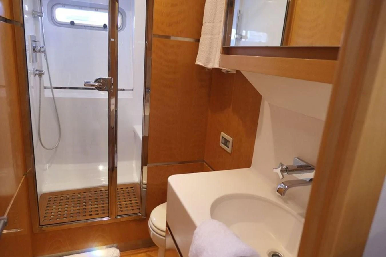 a bathroom with a glass shower door aboard LA LUNA Yacht for Sale