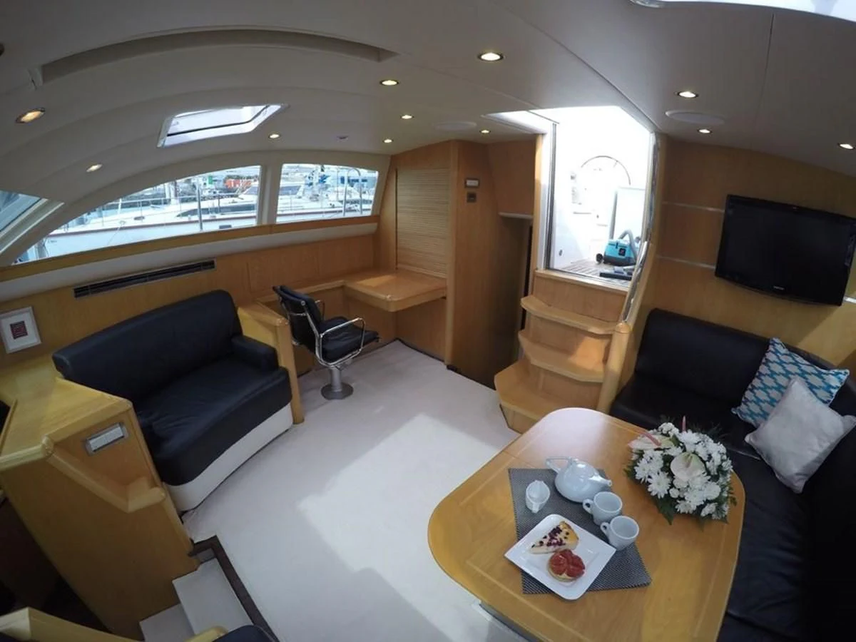 a room with a couch and a table aboard LA LUNA Yacht for Sale