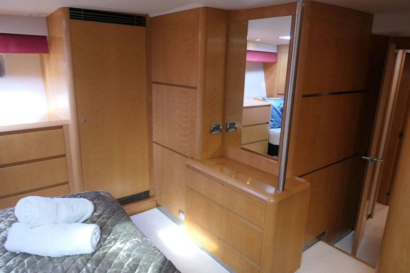 a room with a bed and a mirror aboard LA LUNA Yacht for Sale