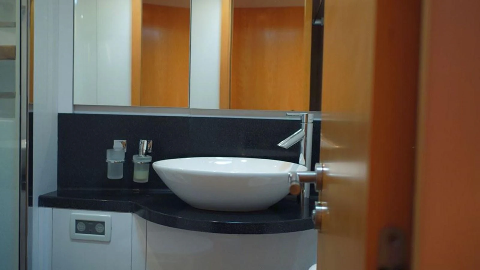 a bathroom with a sink and mirror aboard LA LUNA Yacht for Sale