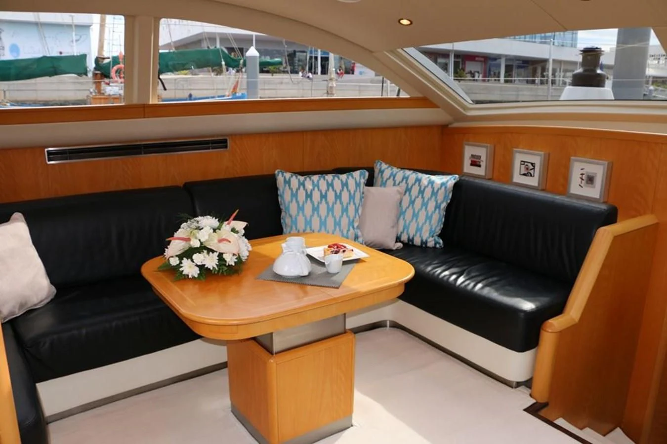a living room with a couch and a coffee table aboard LA LUNA Yacht for Sale