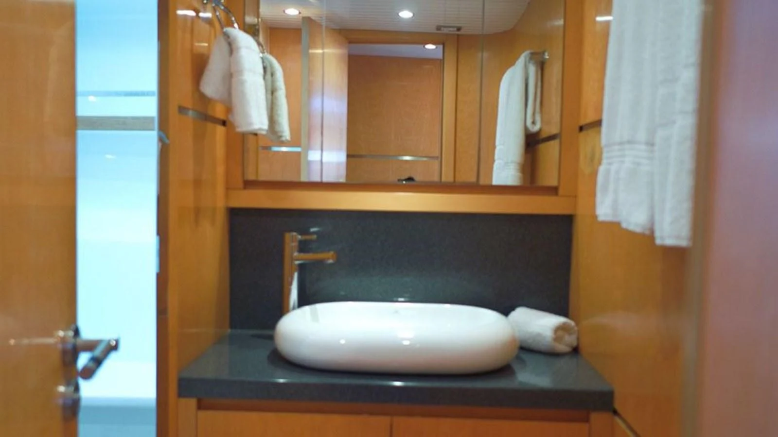 a bathroom with a sink and a mirror aboard LA LUNA Yacht for Sale